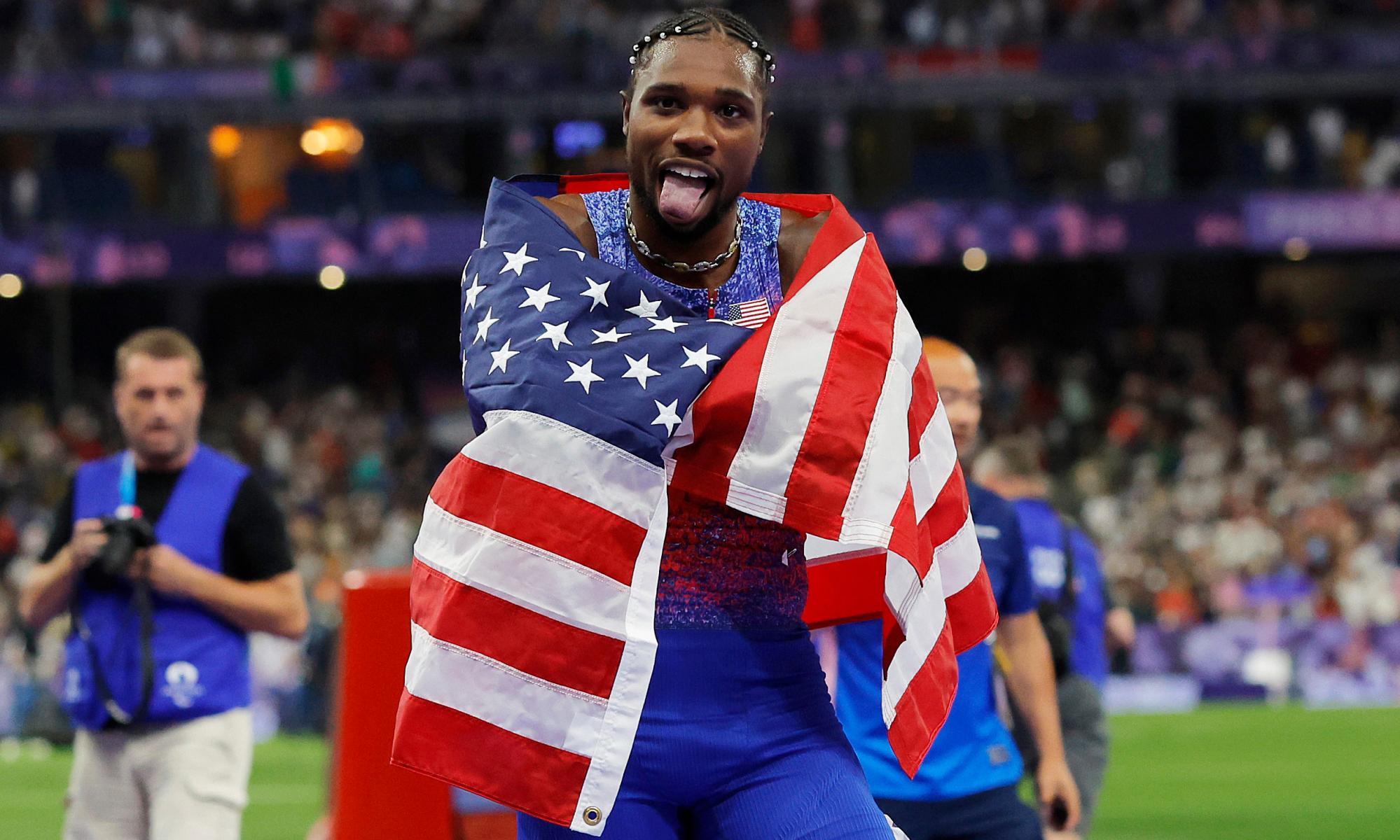 Noah Lyles celebrates his gold in the 100m. Photograph: Tom Jenkins/The Guardian