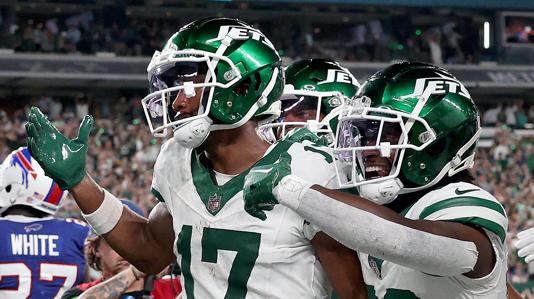 New York Jets wide receiver Garrett Wilson reacting after a big play during an NFL game.