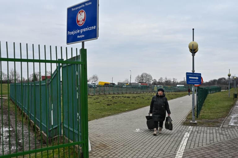 MEDYKA, POLAND - FEBRUARY 17: A woman carries a suitcase as she crosses the Polish Ukrainian border on February 17, 2023 in Medyka, Poland. Since Russia's large scale military attack on Ukraine on February 24, 2022 more than 9.7 million refugees from Ukraine crossed the Polish borders to escape the conflict, with 1.4 million registering in Poland whilst others moved on to other countries. (Photo by Omar Marques/Getty Images)