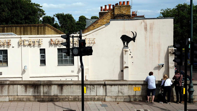 New Banksy artwork taken away by masked people within hours of being  unveiled