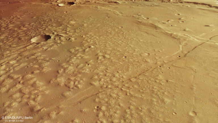 This oblique perspective view was generated from the digital terrain model and the nadir and colour channels of the High Resolution Stereo Camera on ESA’s Mars Express. It shows a region of Mars known as Caralis Chaos, where copious water is thought to have once existed in the form of an ancient lake. Credit: ESA/DLR/FU Berlin