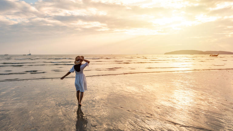 Summer traveler enjoying the beach