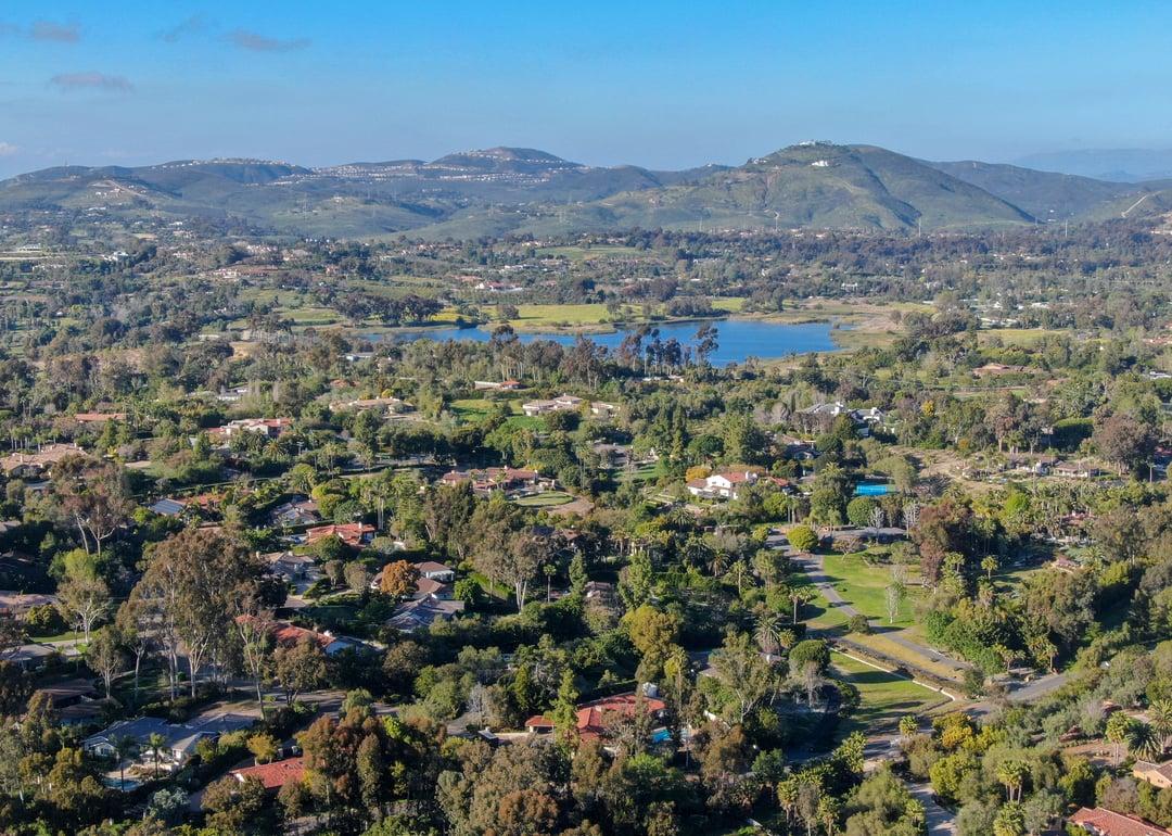 <p>- Population: 2,914</p>  <p>Rancho Santa Fe's history dates back to a time before California's statehood, <a href="https://www.rsfassociation.org/club/scripts/library/view_document.asp?NS=PUBLIC&DN=HISTORY">when Mexico's Gov. Pio Pico awarded the area in a land grant</a> to San Diego's first mayor Juan Osuna in 1840. In the early 1900s, the Atchison, Topeka and Santa Fe Railway company bought the land and planted eucalyptus trees for later use as railroad ties. After that experiment failed, the company decided to turn the land into a residential development, and Rancho Santa Fe, as we know it, was born.</p>