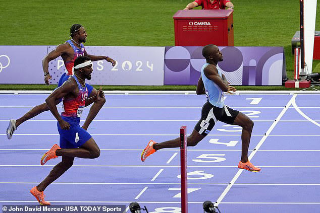 Lyles (back left) crossed the line in third place, despite being the red-hot favorite for the race