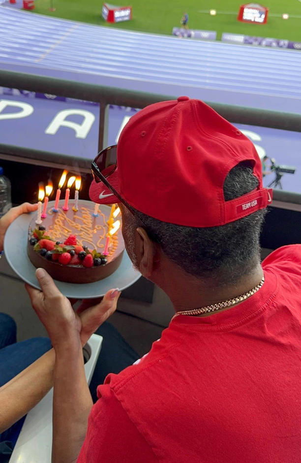 Ronald Biles blows out the candles on his cake.