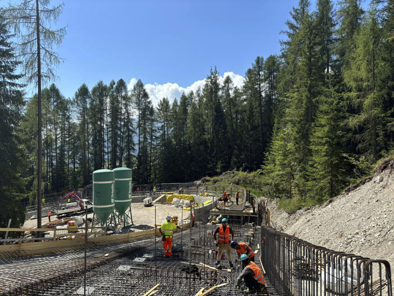 Construction crews work on the sliding center for the 2026 Milan-Cortina Olympics in Cortina d'Ampezzo, Italy, Aug. 8, 2024. (Simico (Società Infrastrutture Milano Cortina 2026) via AP)