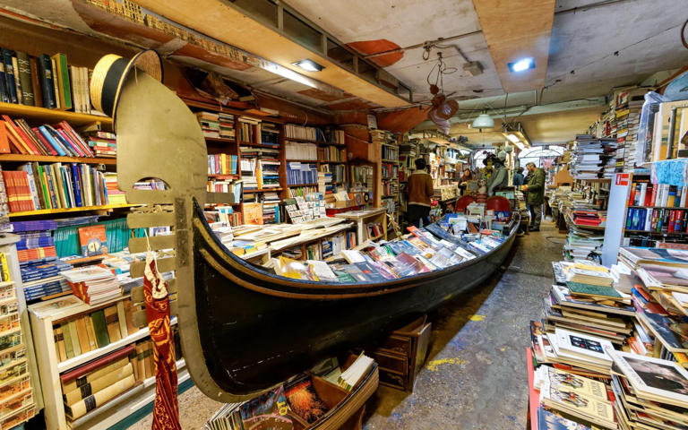 Libreria Acqua Alta bookshop in Venice, which features a gondola filled with books - Alamy