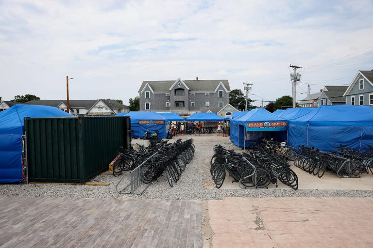 Tents housing a moped and bike rental business occupy the site of the former Harborside Inn on Block Island. Some residents derisively call the area "Tent City."