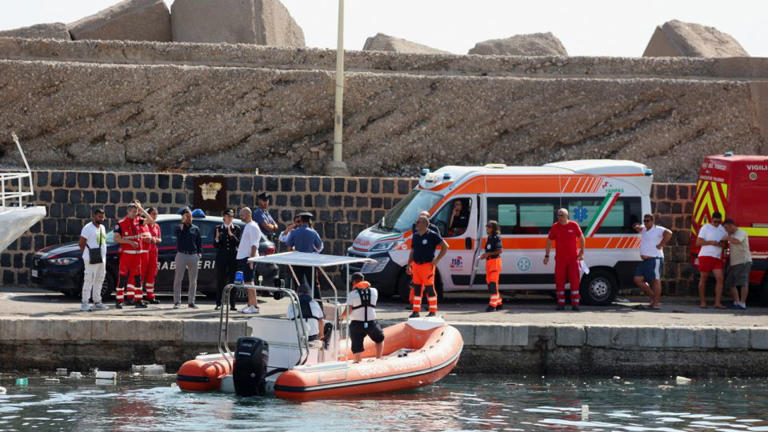 Rescue workers near Palermo, Italy, close to the scene of the incident. - Igor Petyx/Reuters