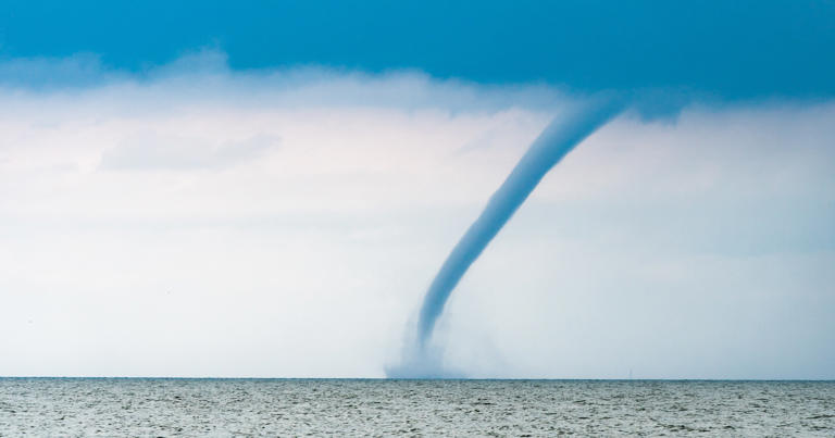 A waterspout, a violent rotating column of air similar to a tornado, forms during stormy weather. It is believed to be the force responsible for sinking the luxury superyacht off the coast of Sicily on Aug. 19.