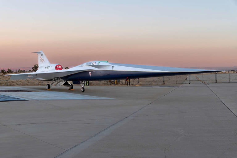 NASA’s X-59 quiet supersonic research aircraft sits on the ramp at Lockheed Martin Skunk Works in Palmdale, California during sunrise, shortly after completion of painting. The X-59 is the centerpiece of NASA’s Quesst mission, which seeks to solve one of the major barriers to supersonic flight over land (which is currently banned in the United States) by making sonic booms quieter. Image credits: NASA.