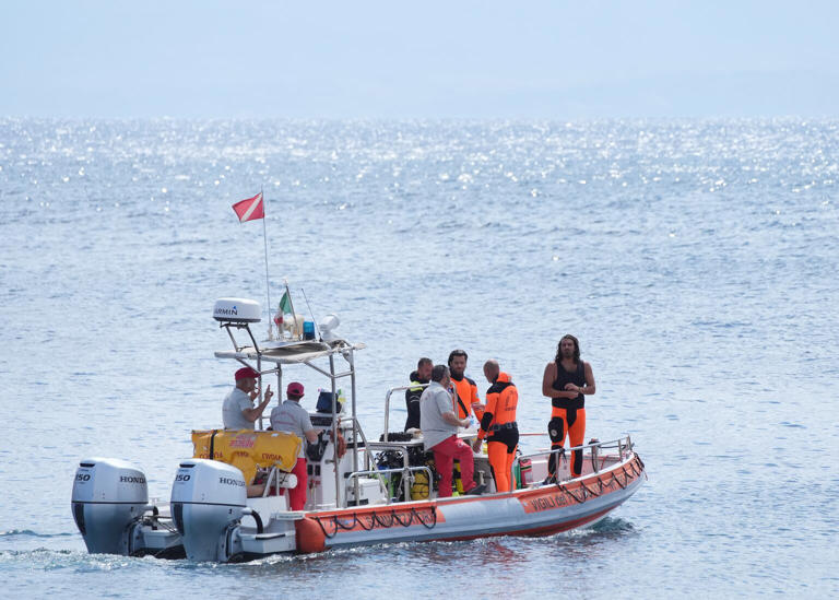 Emergency services spent a second day trying to get inside the submerged yacht