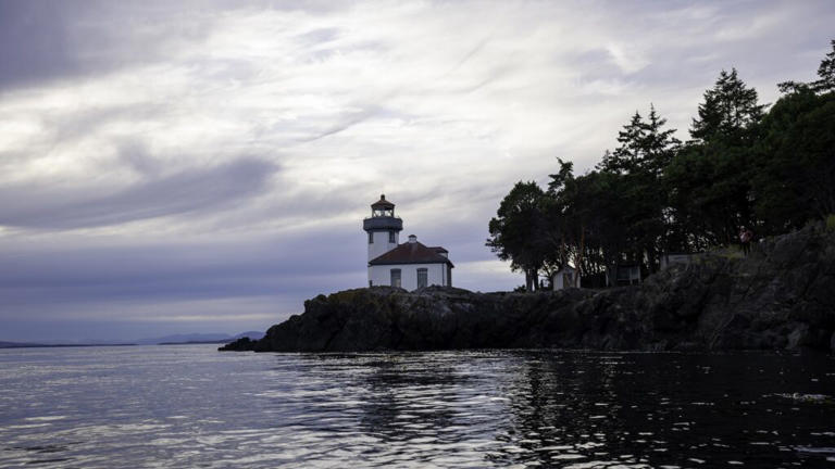 Beautiful lighthouse on the coast of San Juan Island at dusk during an adventurous trip through the larger San Juan Islands archipelago