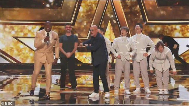 Simon even went up on the stage to celebrate with the Golden Buzzer group