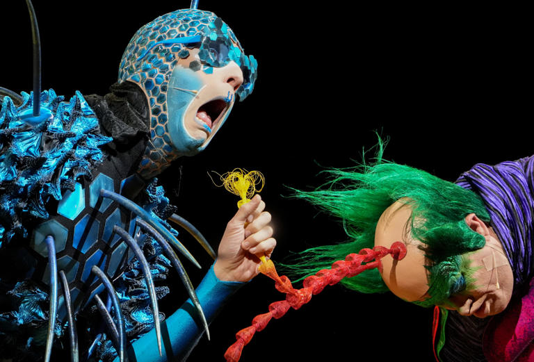 Robin Beer, performing as “The Voyager”, left, interacts with Gerald Regitschnig, performing as “Master Flipo”, during Cirque du Soleil's "OVO" on Thursday, Aug. 22, 2024, at Gainbridge Fieldhouse in Indianapolis.