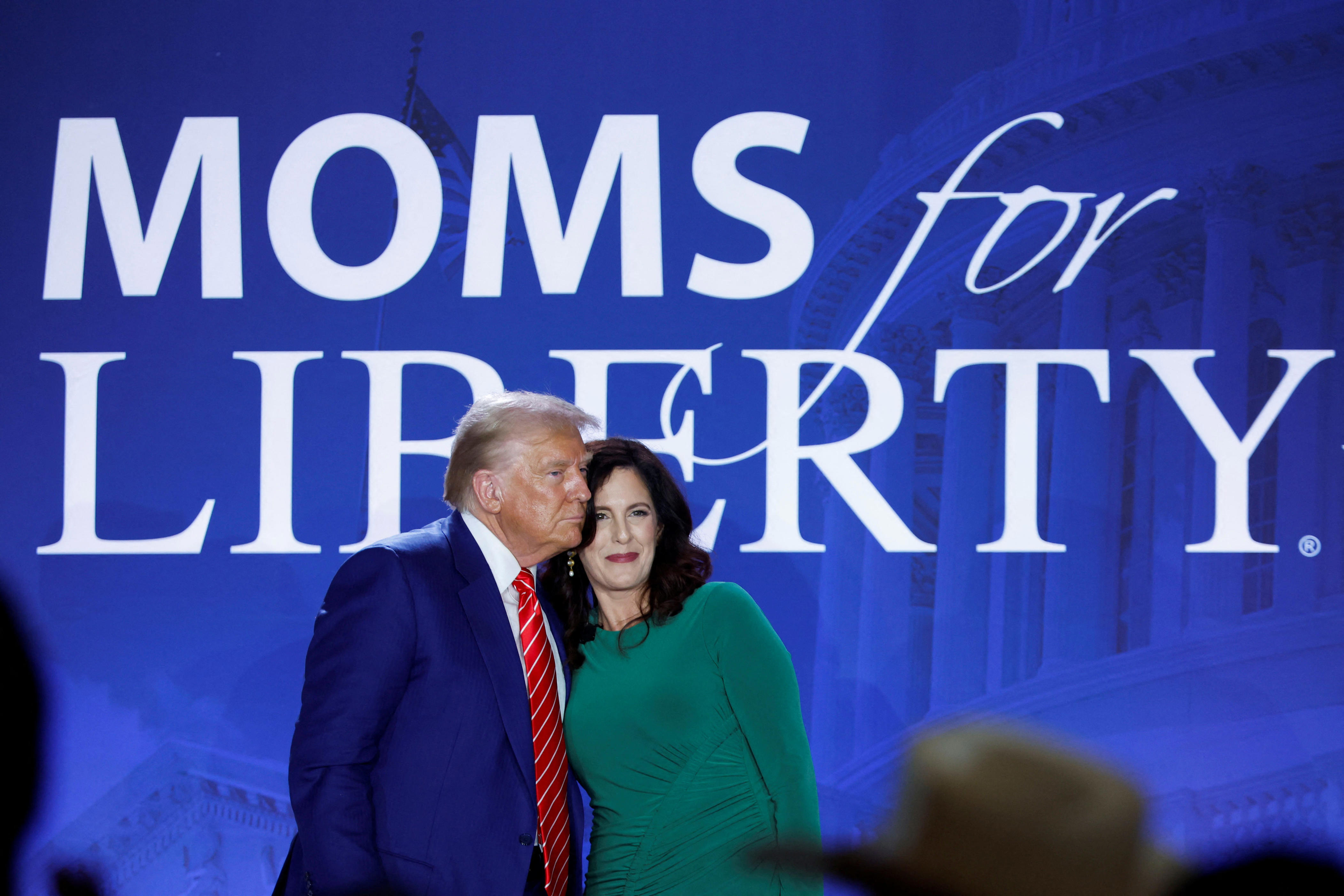 Republican presidential nominee Donald Trump and Moms for Liberty co-founder Tiffany Justice at the group's summit in Washington, D.C., on Aug. 30, 2024.