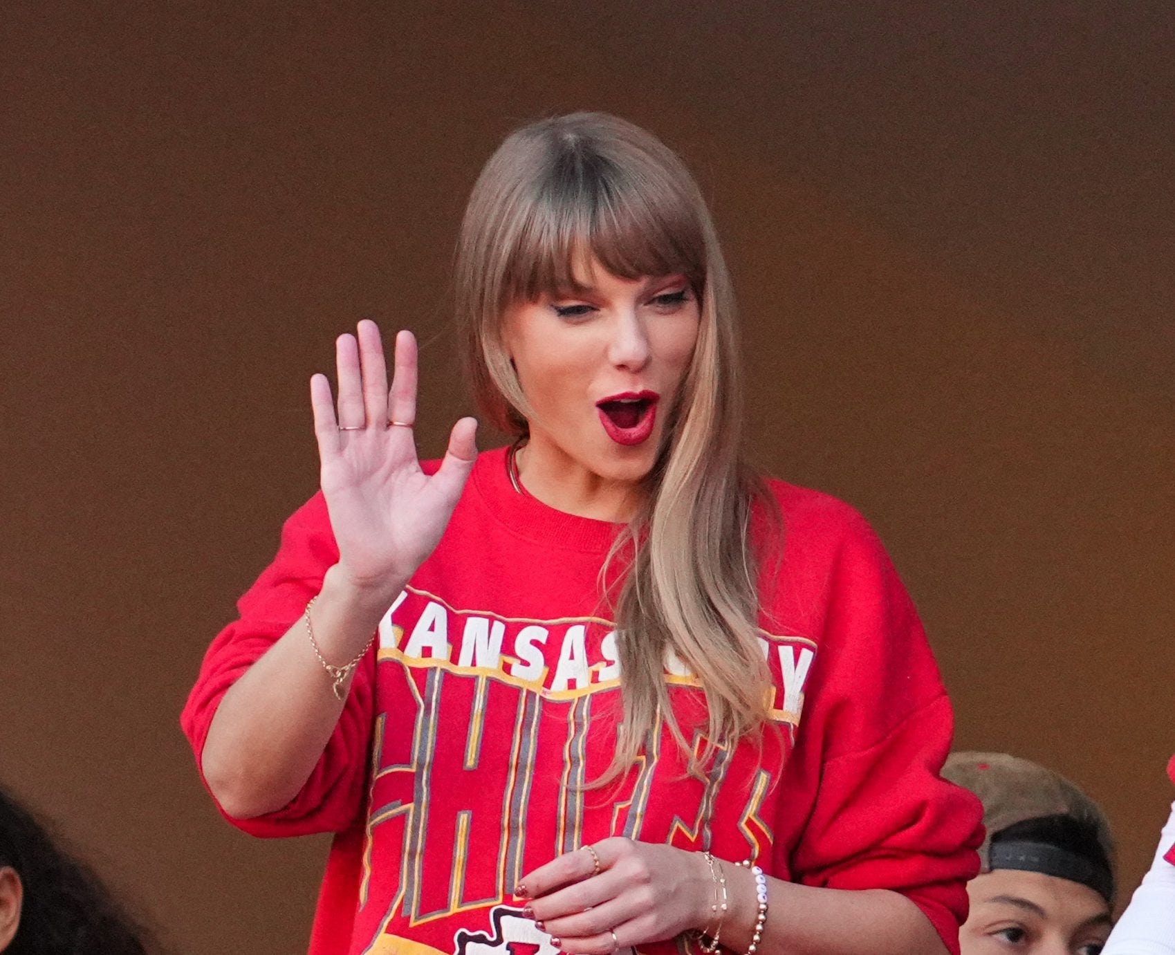 Recording artist Taylor Swift waves to fans during a Chiefs game at GEHA Field at Arrowhead Stadium during the 2023 NFL season.