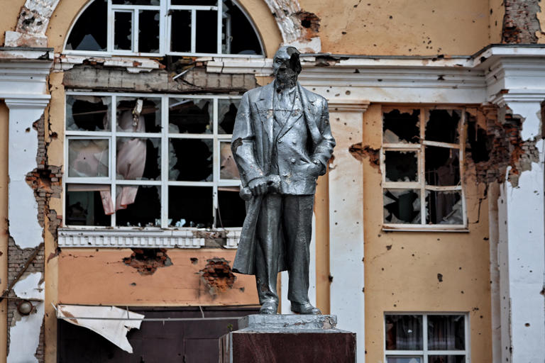 A media tour of the Ukrainian-controlled Russian town of Sudzha in the Kursk region shows a damaged statue of the Soviet Union founder Vladimir Lenin on Aug. 16, 2024. A few days later, Ukrainian President Volodymyr Zelenskyy says his forces have taken control of more than 90 settlements over 480 square miles in Kursk. The invasion has driven nearly 200,000 Russians from their homes.