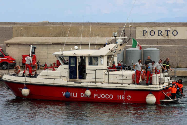 Rescue personnel transport a body after a luxury yacht, which was carrying British entrepreneur Mike Lynch, sank off the coast of Porticello, near the Sicilian city of Palermo, Italy, August 21, 2024. REUTERS/Louiza Vradi