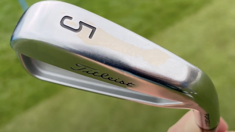 You can always tell when an iron sole has been re-contoured by the slight discolouration as seen here on Ian Poulter's Titleist T100 5-iron. (Image credit: Future)