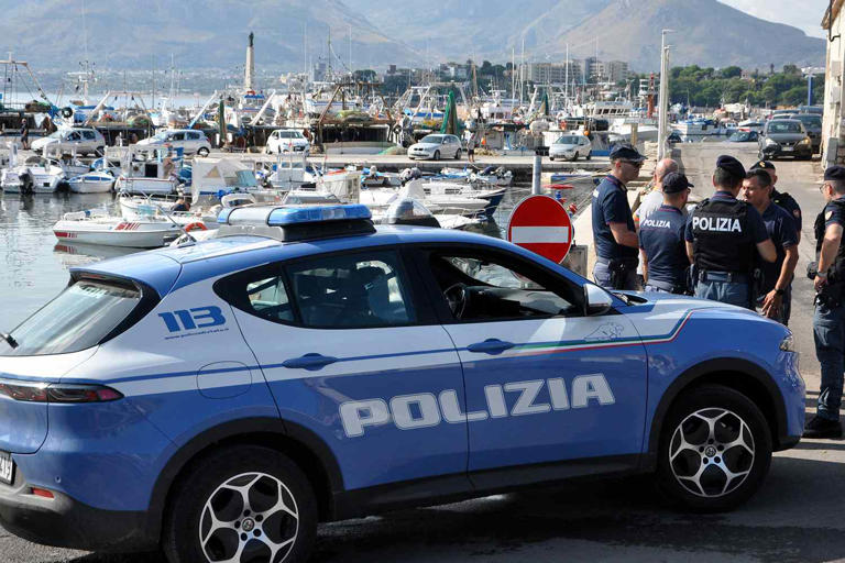 ALESSANDRO FUCARINI/AFP via Getty A photo of a police car as the search continues for the six missing people after a luxury yacht sank off the coast of Sicily