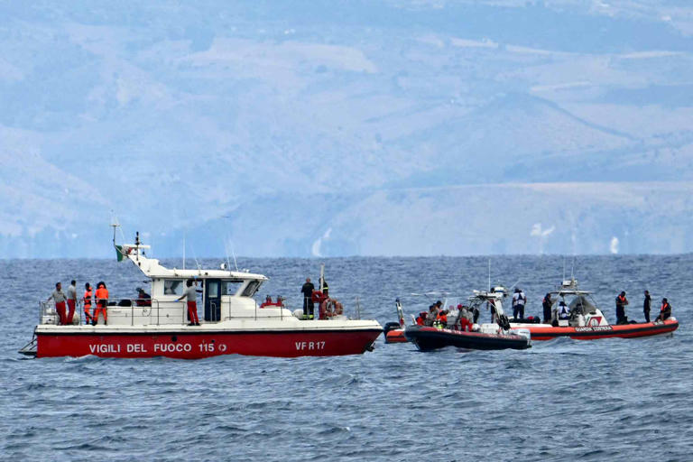 ALBERTO PIZZOLI/AFP via Getty Rescue boats of the Vigili del Fuoco, the Italian Corps. of Firefighters operate off Porticello near Palermo, on August 21, 2024.