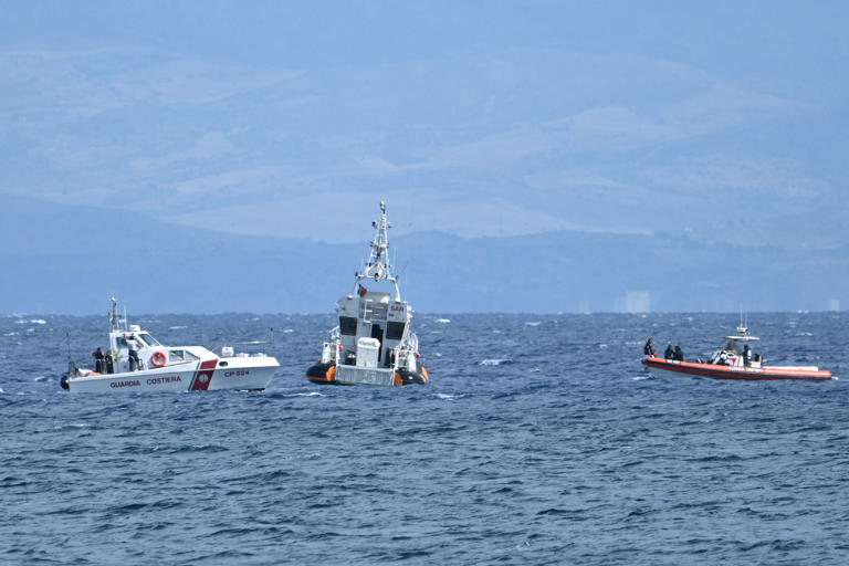 Rescue boats operate off Porticello, on August 20, 2024 near Palermo a day after the British-flagged luxury yacht Bayesian sank. Specialist divers launched a fresh search for six people, including UK tech tycoon Mike Lynch and the chairman of Morgan Stanley International, missing since their yacht capsized off the Italian island of Sicily. The Bayesian, which had 22 people aboard including 10 crew, was anchored some 700 metres from port before dawn when it was struck by a waterspout, a sort of mini tornado. Fifteen people aboard, including a mother with a one-year-old baby, were plucked to safety; one man has been found dead; and six people remain missing. (Photo by ALBERTO PIZZOLI/AFP via Getty Images)