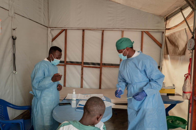 Health workers collect samples for testing at the Mpox treatment centre at Nyiragongo General Referral Hospital, north of Goma on August 17, 2024. Amid a global health emergency over mpox, African health authorities are now requesting more vaccines as Congo has reported a significant increase in mpox cases, with over 1,000 new infections recorded in just the past week.