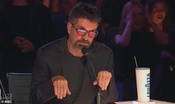 Simon Cowell apologized on Wednesday's episode of America's Got Talent for trying to steal Howie Mandel 's Golden Buzzer on the previous night's live show