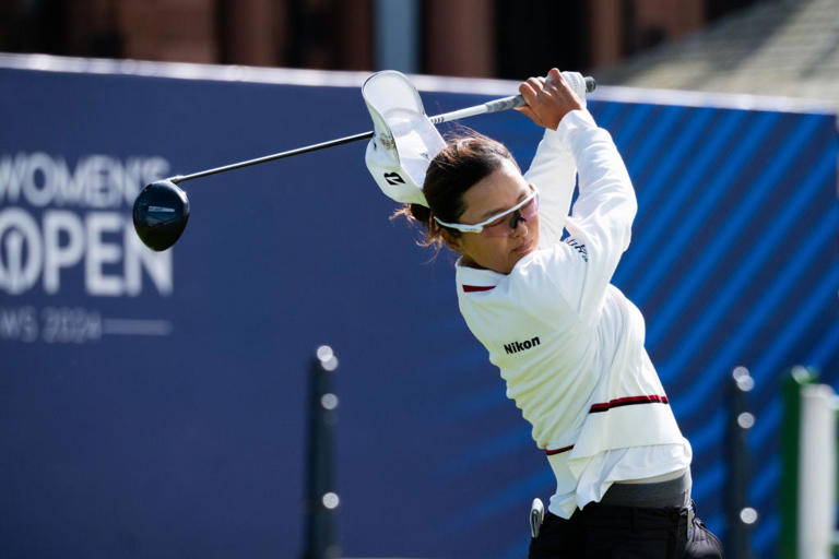 Jin Young Ko of South Korea loses her hat to the wind while teeing off (Getty Images)