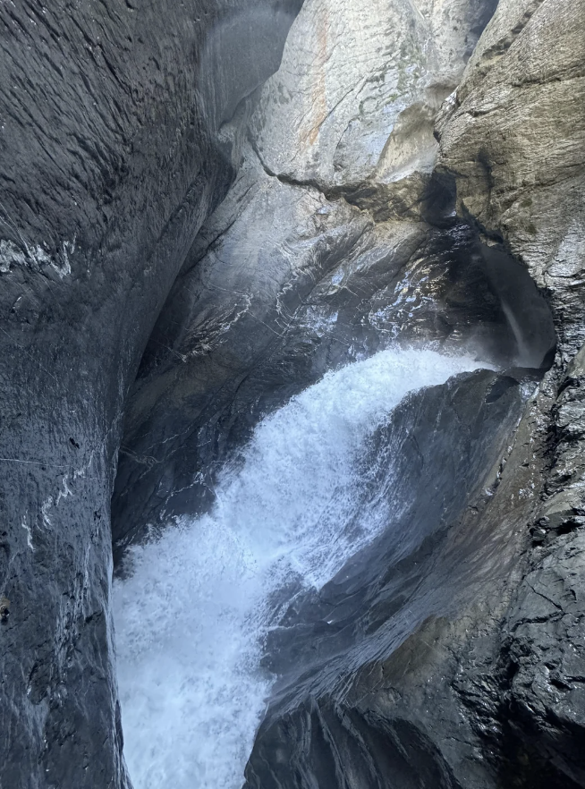 I am not 100% sure, so here is what Reddit says: "I would say up is the top of the photo, based on the sunspots in the photo. Also…the rocks in the bottom of the photo seem wet, while the rocks near the top seem dry." — u/bellardyyc "The shape of the rocks from erosion looks like the photographer is looking down. I'd guess it's somewhere in between these two directions." — u/Redstone_Engineer u/spencerak / reddit.com