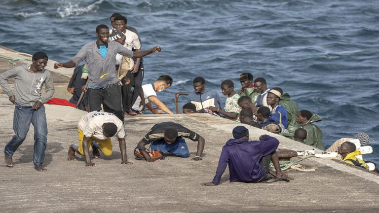 A dozen of migrant on shore of the Canary Island in Spain