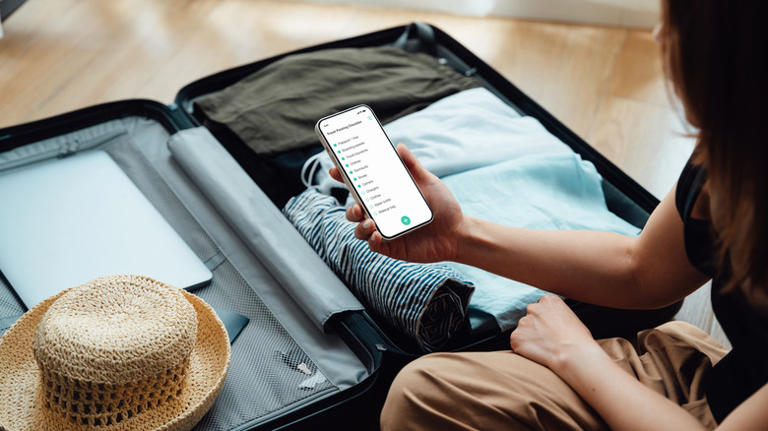 Woman packing a suitcase