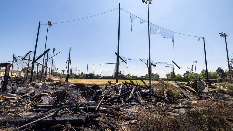 A view of the remains of the historic wooden grandstand and dugouts after a late Thursday morning fire destroyed the historic baseball field and filming location at Jay Littleton Ball Park in Ontario, Calif., on Saturday. Getty Images