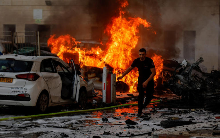 A fire burns in Ashkelon, Israel after rockets were launched from the Gaza Strip