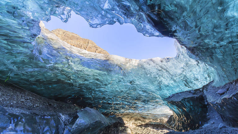 The group of 25 foreign tourists from several nationalities were exploring ice caves, like the one pictured above, with a guide on Sunday when falling ice struck four people, local authorities said. Getty Images