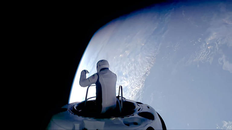 Jared Isaacman, commander of the Polaris Dawn mission, performing the first private spacewalk.