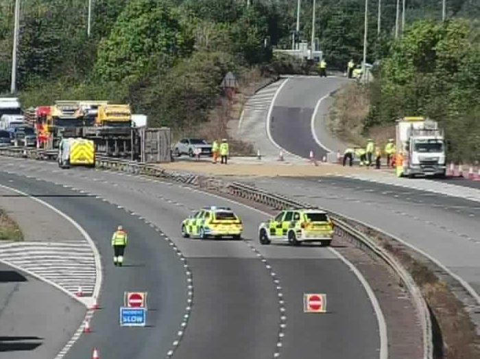 Footage appears to show a lorry flipped on its side after breaching the central reservation (Picture: Highways England)