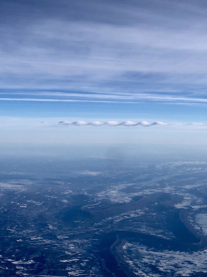 #25 This Funky Little Ribbon Cloud Outside My Plane Window
