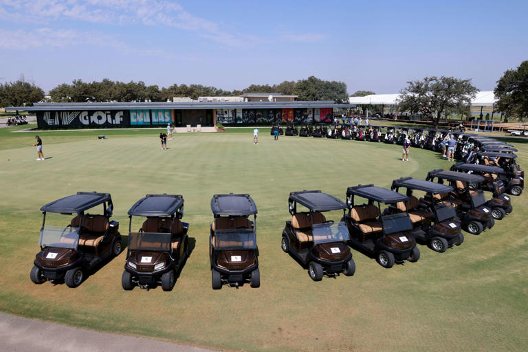 Golfers and carts seen outside of the LIV Golf Dallas logo during media day for the LIV Golf Team Championships at Maridoe Golf Club in Carrollton on Thursday, Aug. 22, 2024. The tournament runs Sept. 20-22.