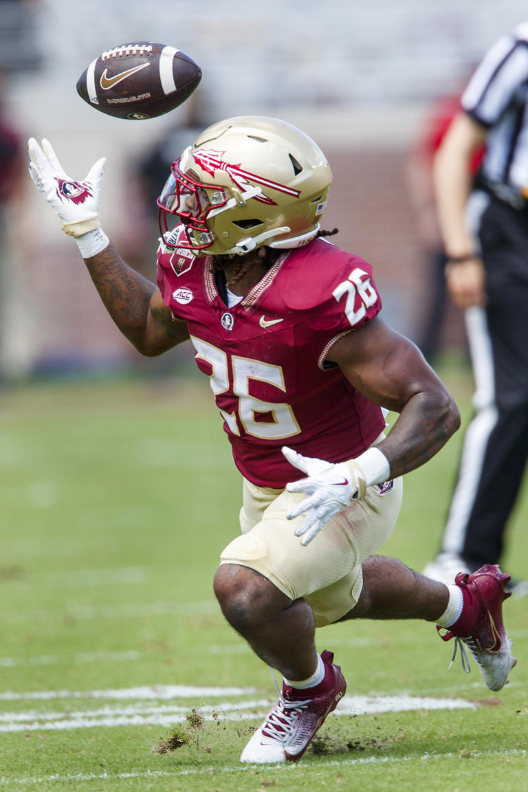 Florida State running back Caziah Holmes (26) juggles a pass before dropping it during the first half of an NCAA college football game against Memphis, Saturday, Sept. 14, 2024, in Tallahassee, Fla. Memphis won 20-12. (AP Photo/Colin Hackley)