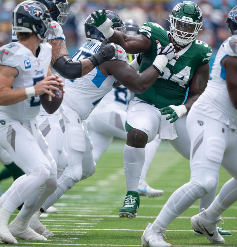 Tennessee Titans quarterback Will Levis (8) is pressured by New York Jets defensive tackle Javon Kinlaw (54) during their game at Nissan Stadium in Nashville, Tenn., Sunday, Sept. 15, 2024.