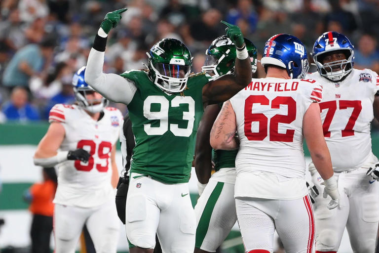 Aug 24, 2024; East Rutherford, New Jersey, USA; New York Jets defensive end Takkarist McKinley (93) reacts to a defensive play against the New York Giants during the second half at MetLife Stadium. Mandatory Credit: Rich Barnes-USA TODAY Sports