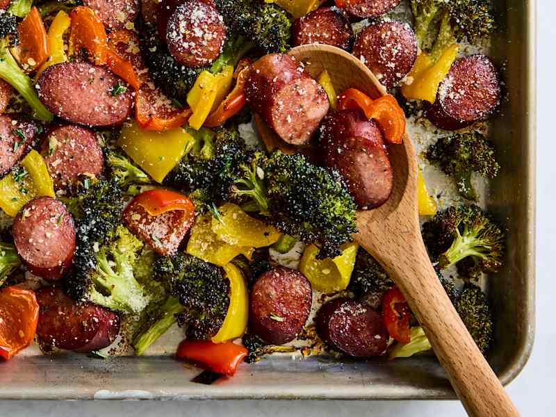 kielbasa on sheet pan with spoon