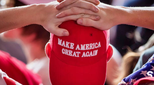 Person wearing Red MAGA hat (Photo by Drew Angerer/Getty Images)