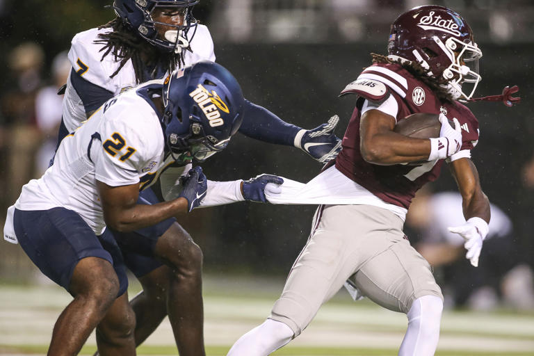 Mississippi State wide receiver Mario Craver (7) scores a touchdown against Toledo defensive back Nasir Bowers (21) during the second half of an NCAA college football game in Starkville, Miss., Saturday, Sept. 14, 2024. (AP Photo/James Pugh)