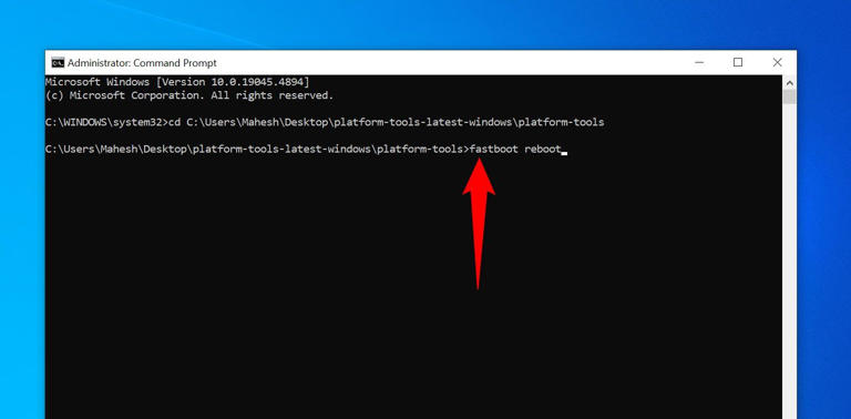 The 'fastboot reboot' command typed in Command Prompt.