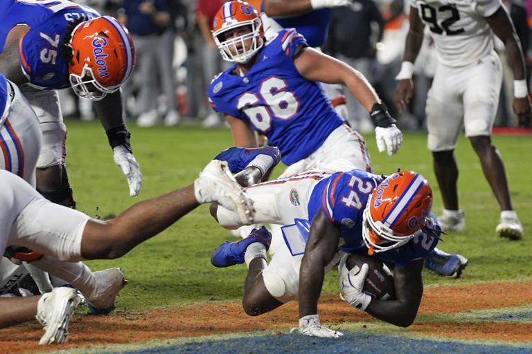 Florida running back Ja'Kobi Jackson (24) dives over the goal line to score a touchdown on a 2-yard run during the second half of an NCAA college football game against Texas A&M, Saturday, Sept. 14, 2024, in Gainesville, Fla. (AP Photo/John Raoux)