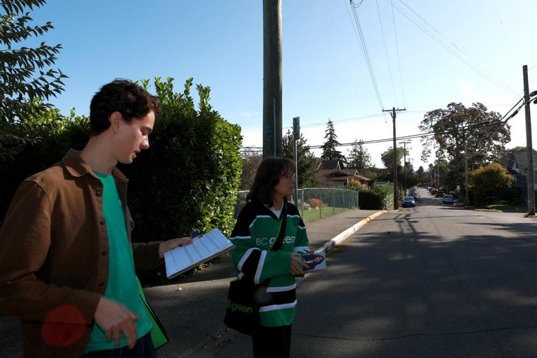 B.C. Green Party Leader Sonia Furstenau officially launches her campaign for Victoria-Beacon Hill with her son Peter Salmon as they door knock in the Fernwood area in Victoria, Saturday, Sept. 21, 2024. THE CANADIAN PRESS/Chad Hipolito