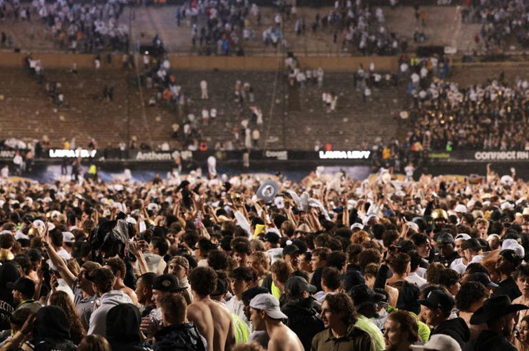 Colorado fans storm field before game is over after Shedeur Sanders miracle  play